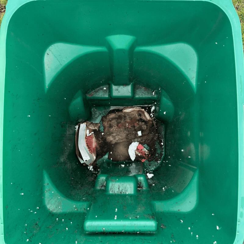 Before and after photos of the inside of a residential garbage bin